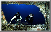 Divers At A Wreck